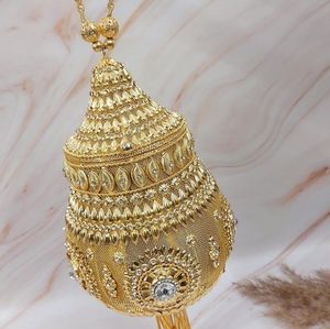 Golden brass matka clutch